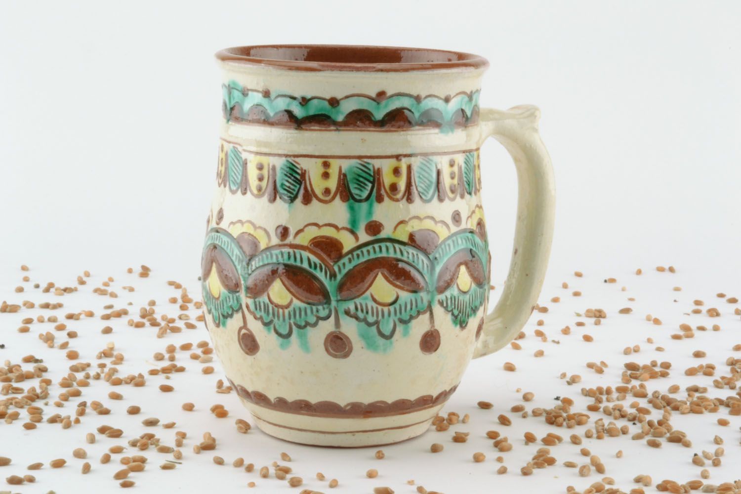 Decorative clay mug photo 1