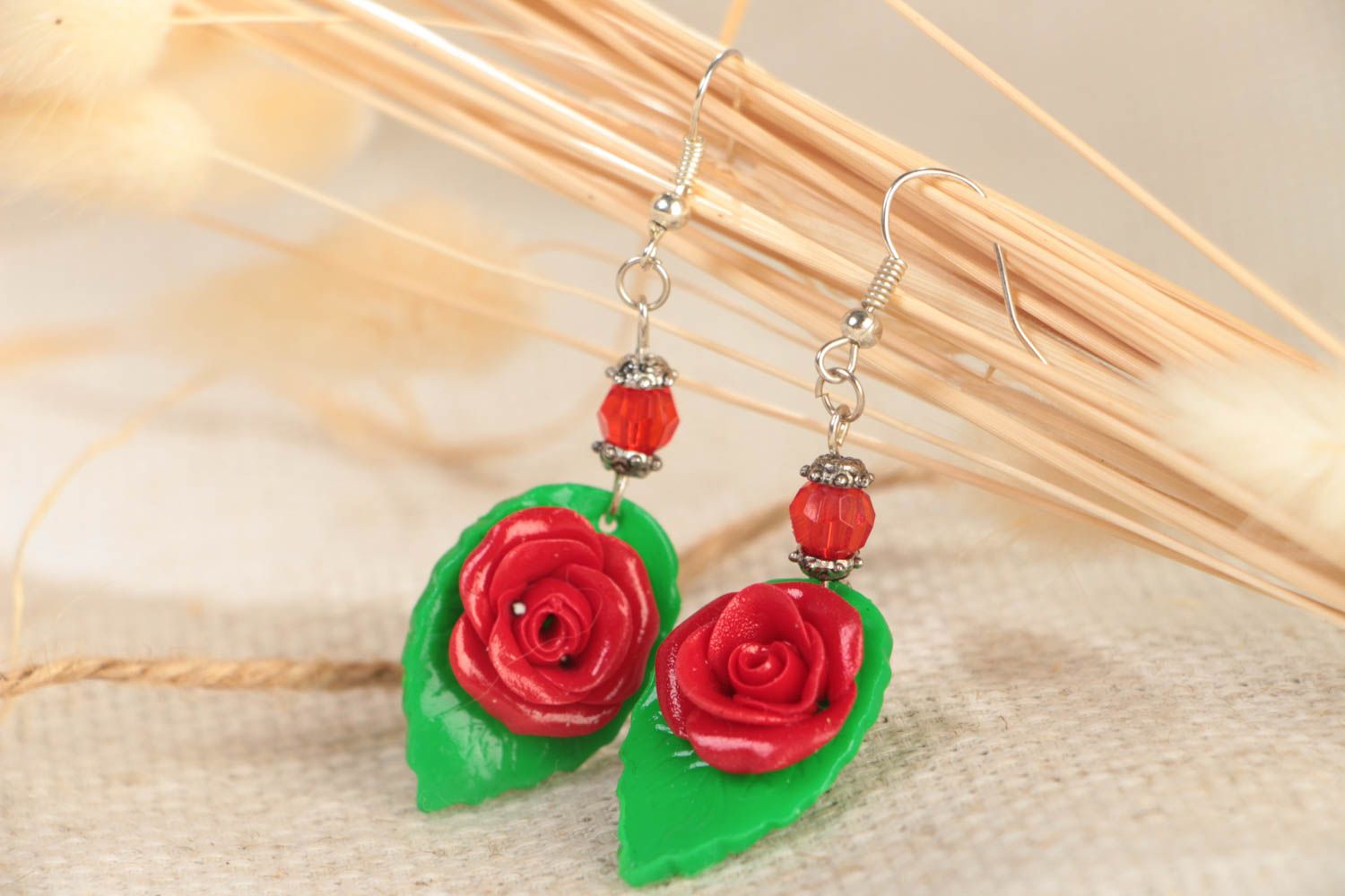 Handmade designer festive polymer clay dangling earrings with red flowers  photo 1