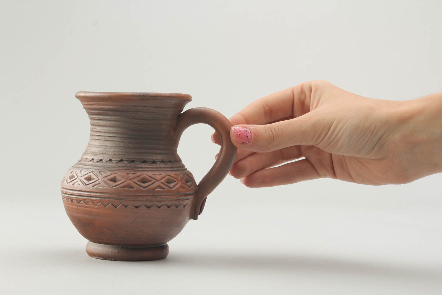 8 oz natural clay cup in the shape of the pitcher with handle and rustic pattern photo 2