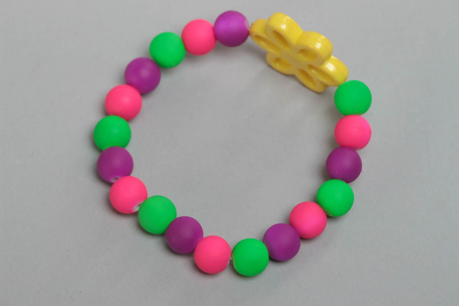 Unusual bright handmade children's plastic ball bracelet with flower photo 4