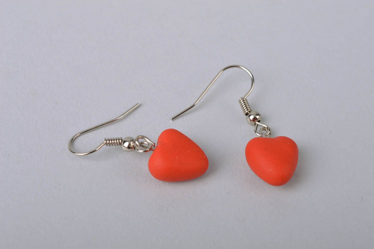 Handmade laconic romantic dangle earrings with small cold porcelain red hearts photo 3