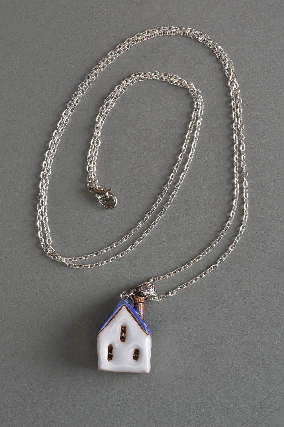 Unusual handmade designer painted ceramic neck pendant in the shape of house on long chain photo 1