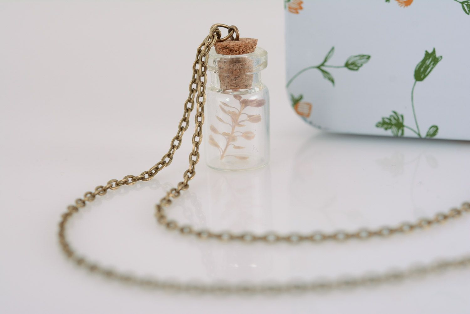 Handmade glass neck pendant in the shape of jar with plant inside with long chain photo 3