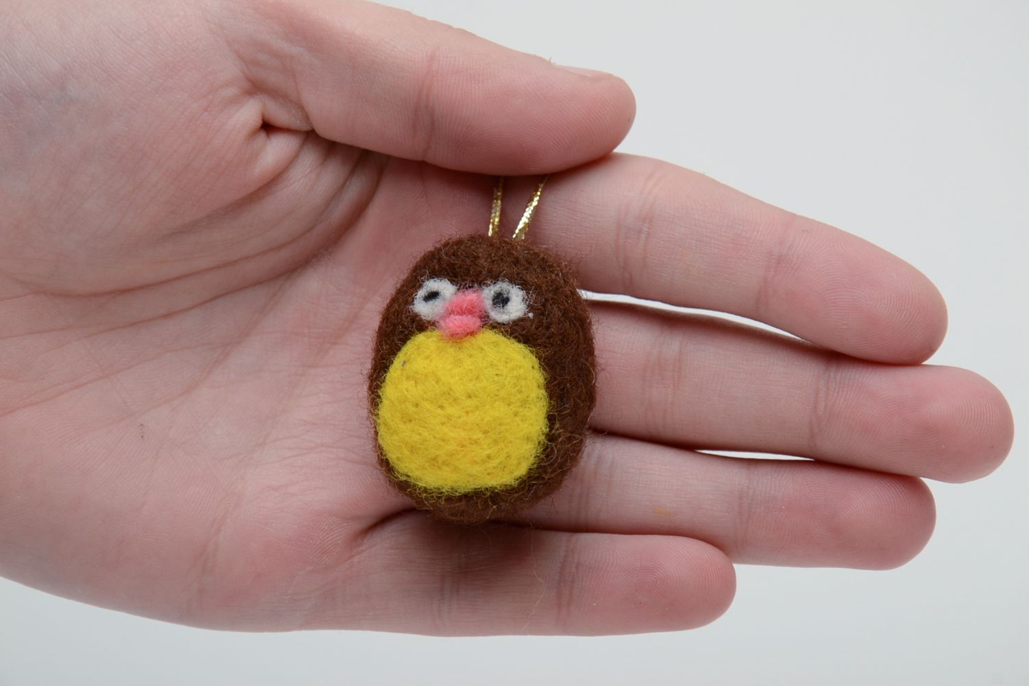 Small felted toy with eyelet photo 5