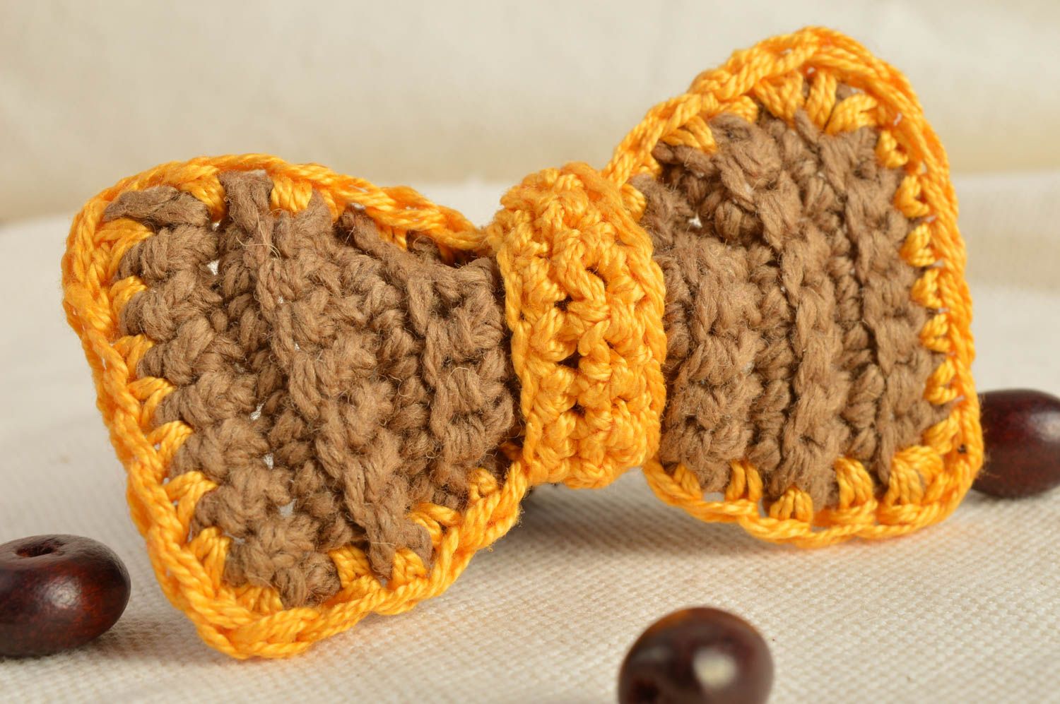 Small handmade children's crochet bow hair tie beige and yellow photo 1