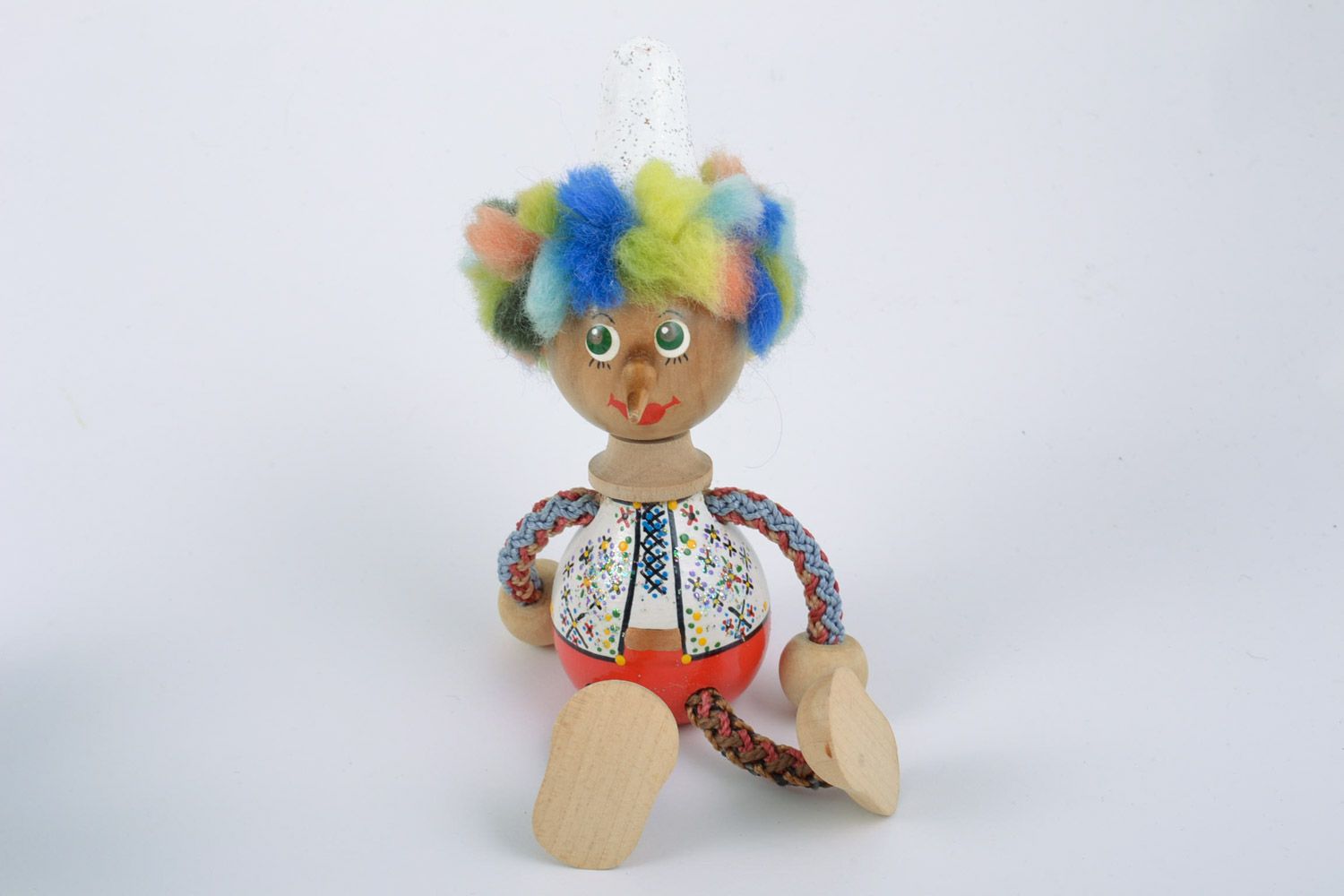 Bright children's handmade painted wooden toy in the shape of clown photo 3