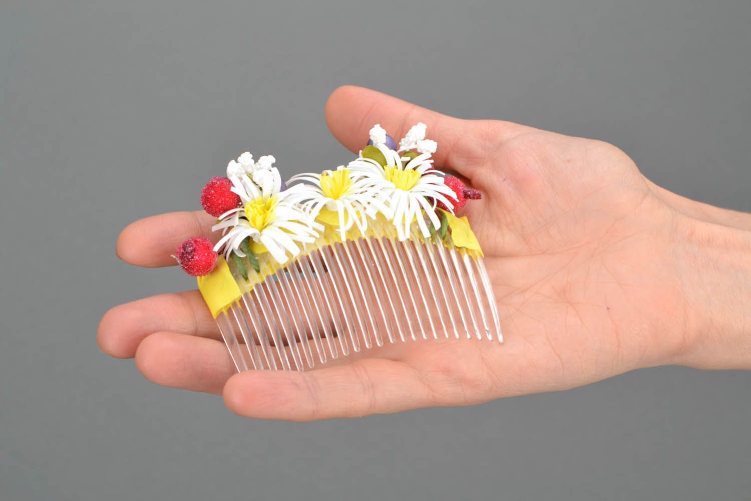 Plastic hair comb with artificial flowers photo 2