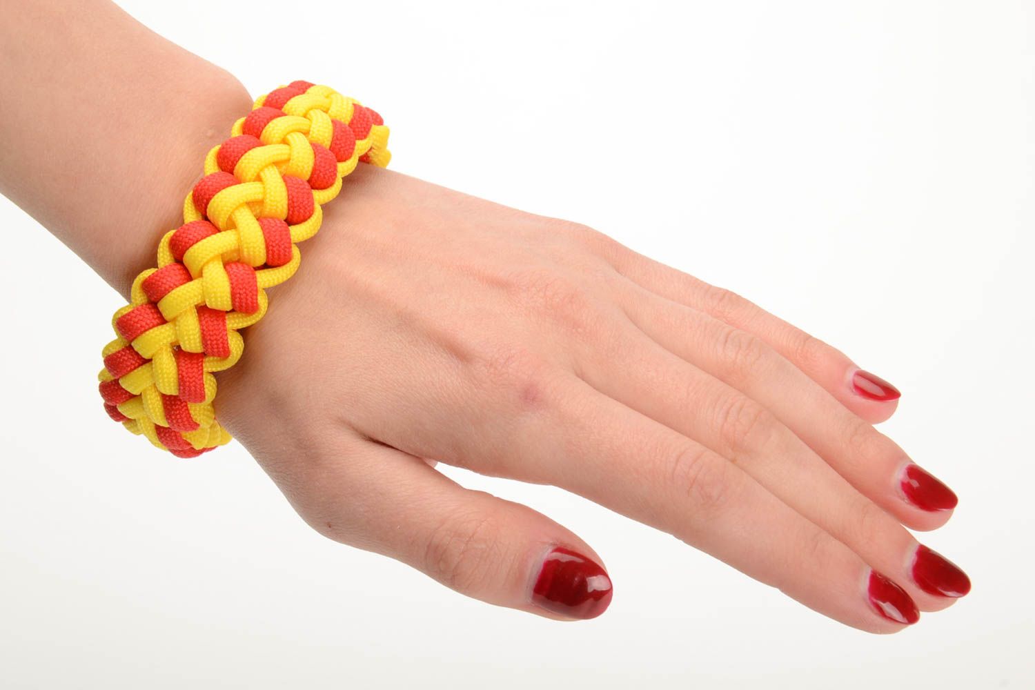 Red and yellow handmade wrist bracelet woven of American paracord photo 5