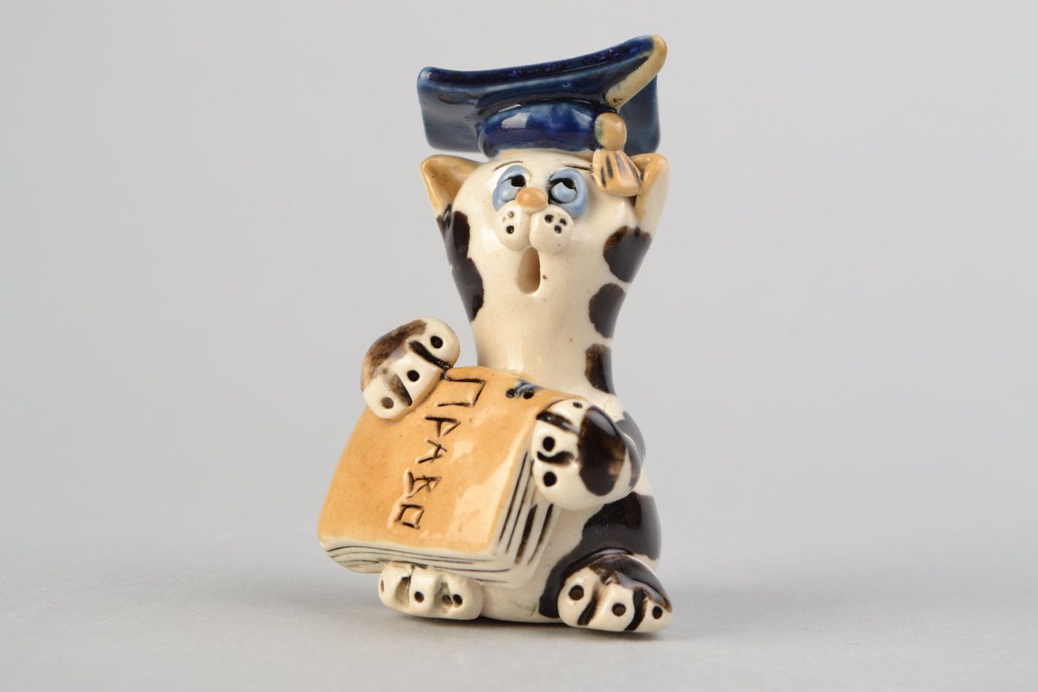 Handmade decorative clay figurine cat in hat painted with colored glaze for home decor photo 1