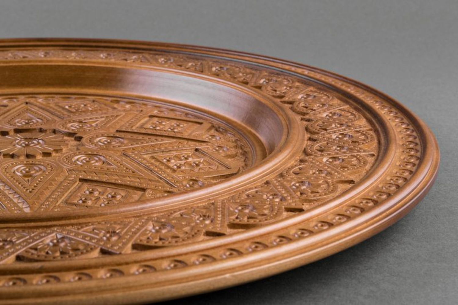 Carved decorative plate made ​​of wood photo 2