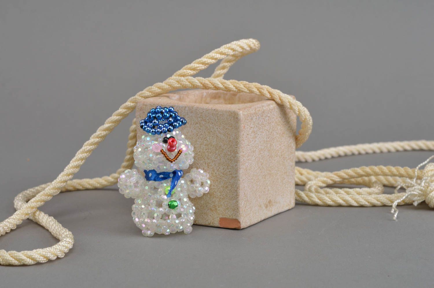Handmade beautiful souvenir figurine woven of beads Snowman djay for home decor photo 1