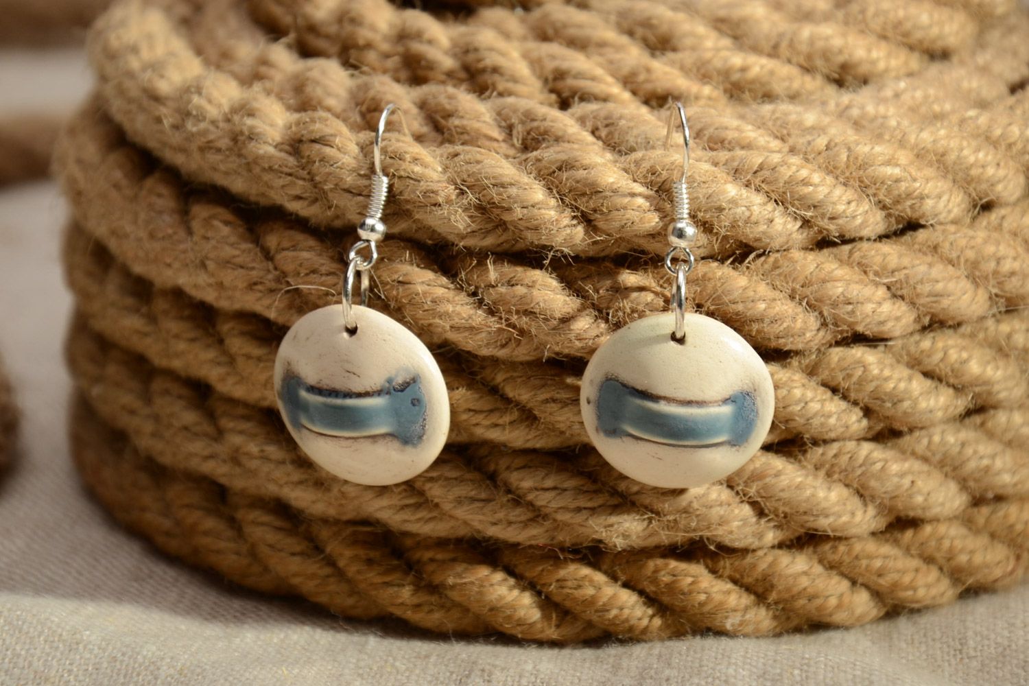 Handmade laconic beige round dangle ceramic earrings painted with enamels photo 1