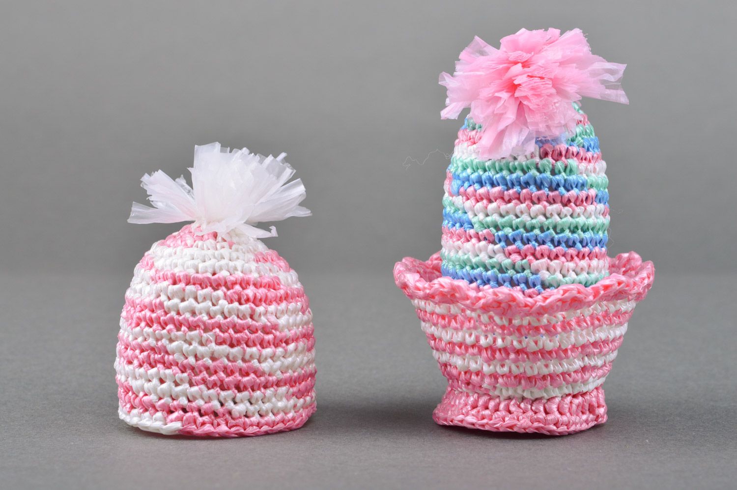 Handmade decorative Easter egg crocheted of pink threads on stand and cover photo 2
