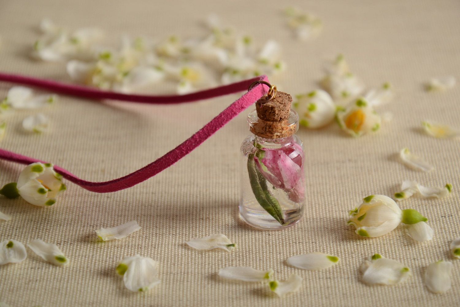 Handmade neck pendant with real flowers coated with epoxy resin in the shape of vial photo 1