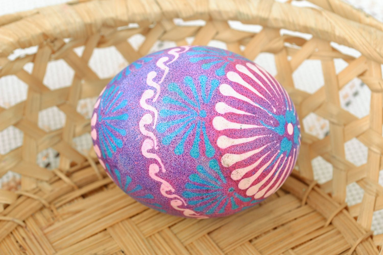 Handmade Easter egg painted with wax in Lemkiv style in blue and violet colors photo 1