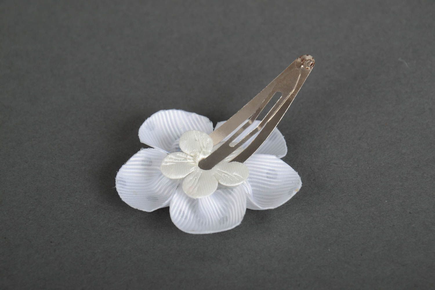 Beautiful satin ribbon flower hair clip of white color with black dots photo 3