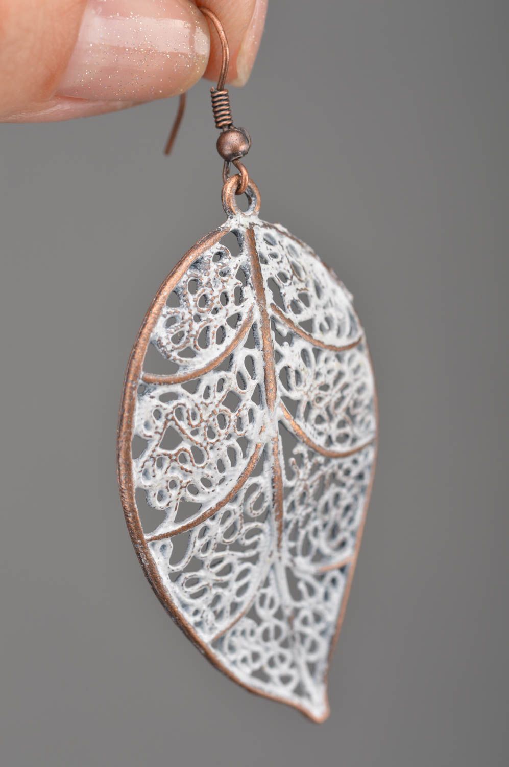 Metal elegant beautiful handmade earrings in shape of leaves for present photo 2