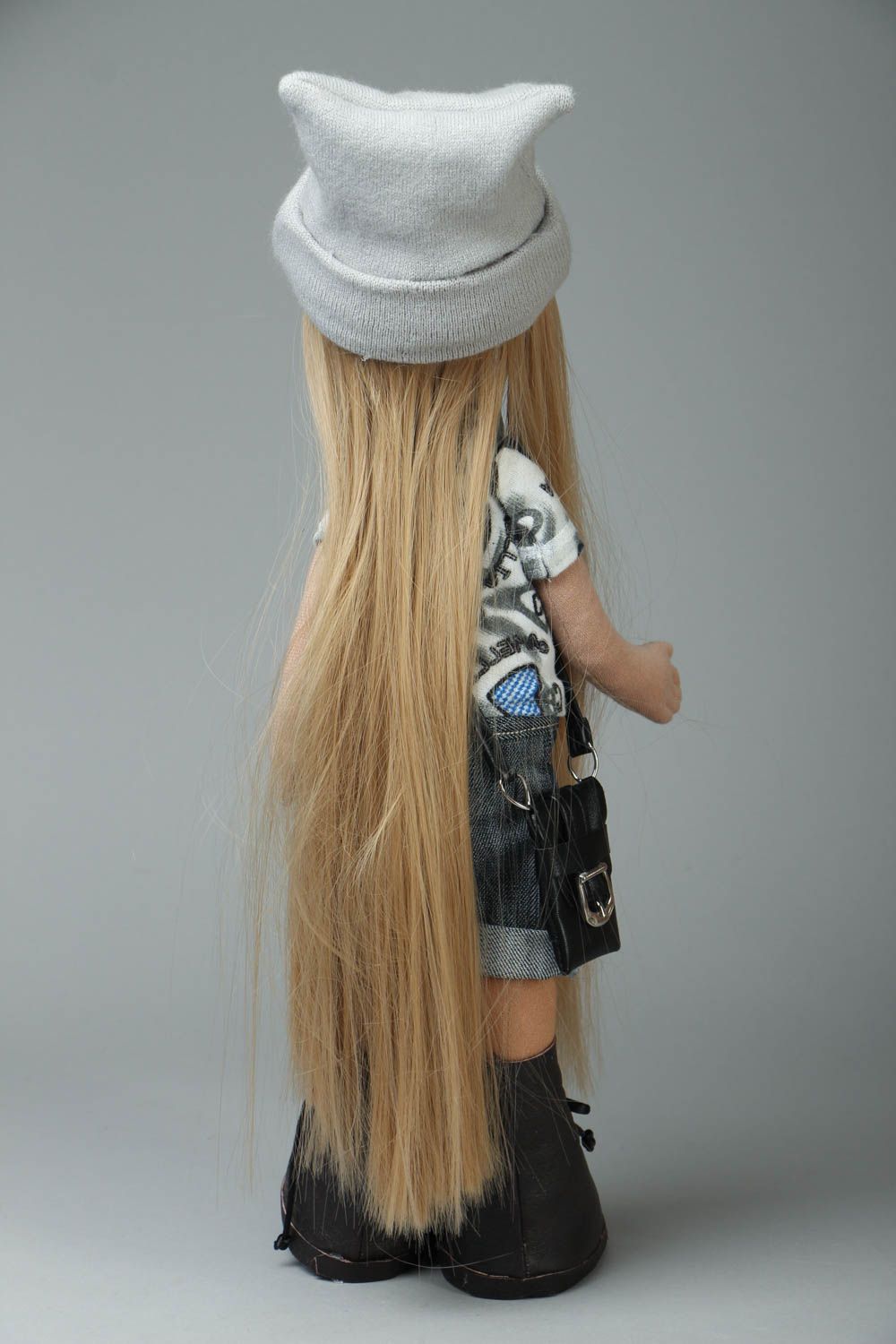 Soft doll with a hat photo 3
