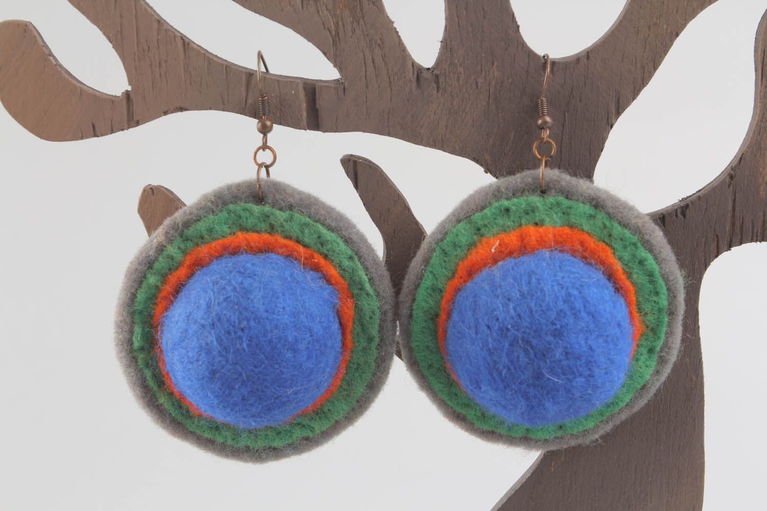 Round earrings made of wool and felt using felting technique photo 1