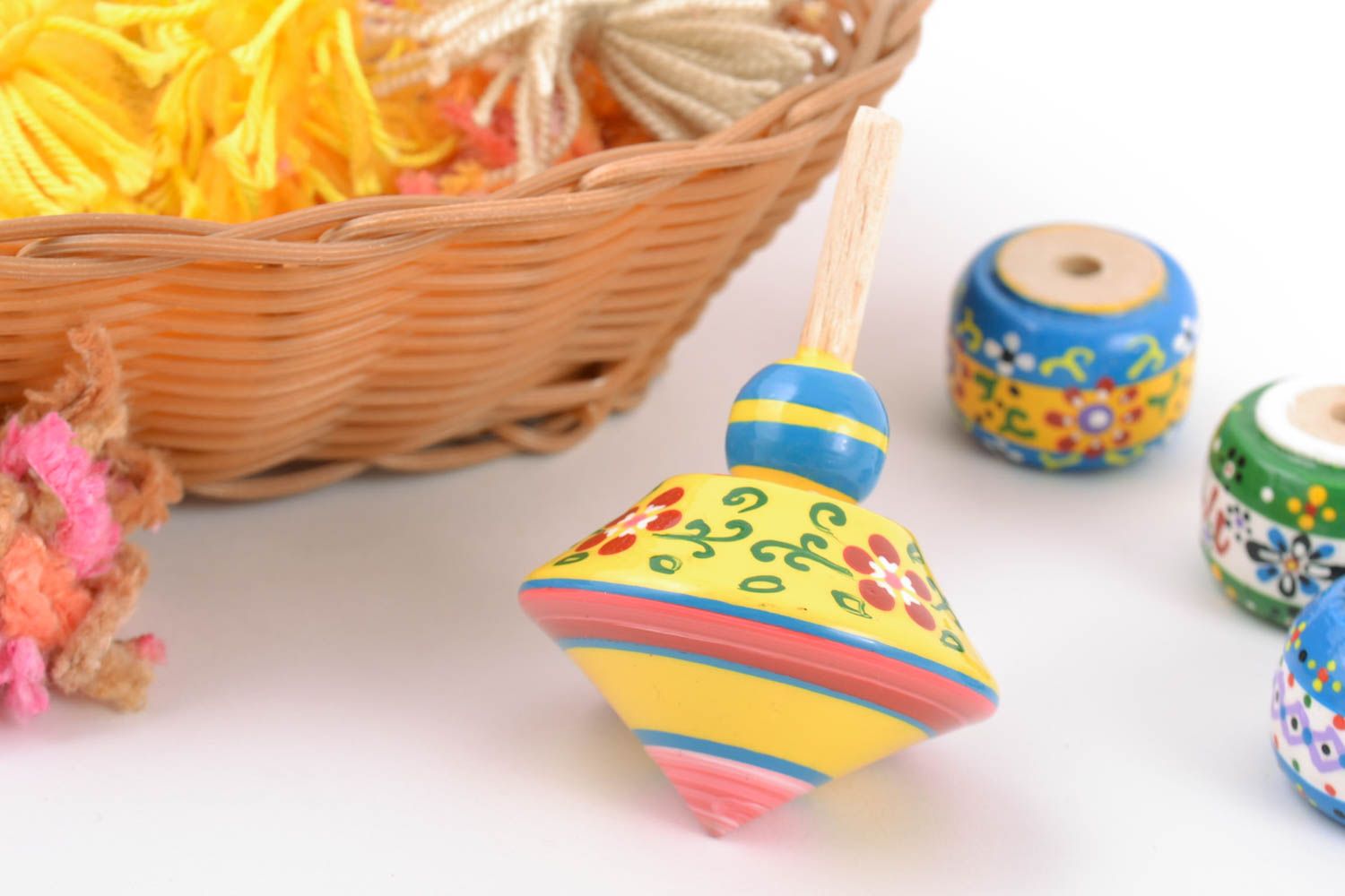 Wooden yellow handmade spinning top toy painted with eco dyes for children  photo 1