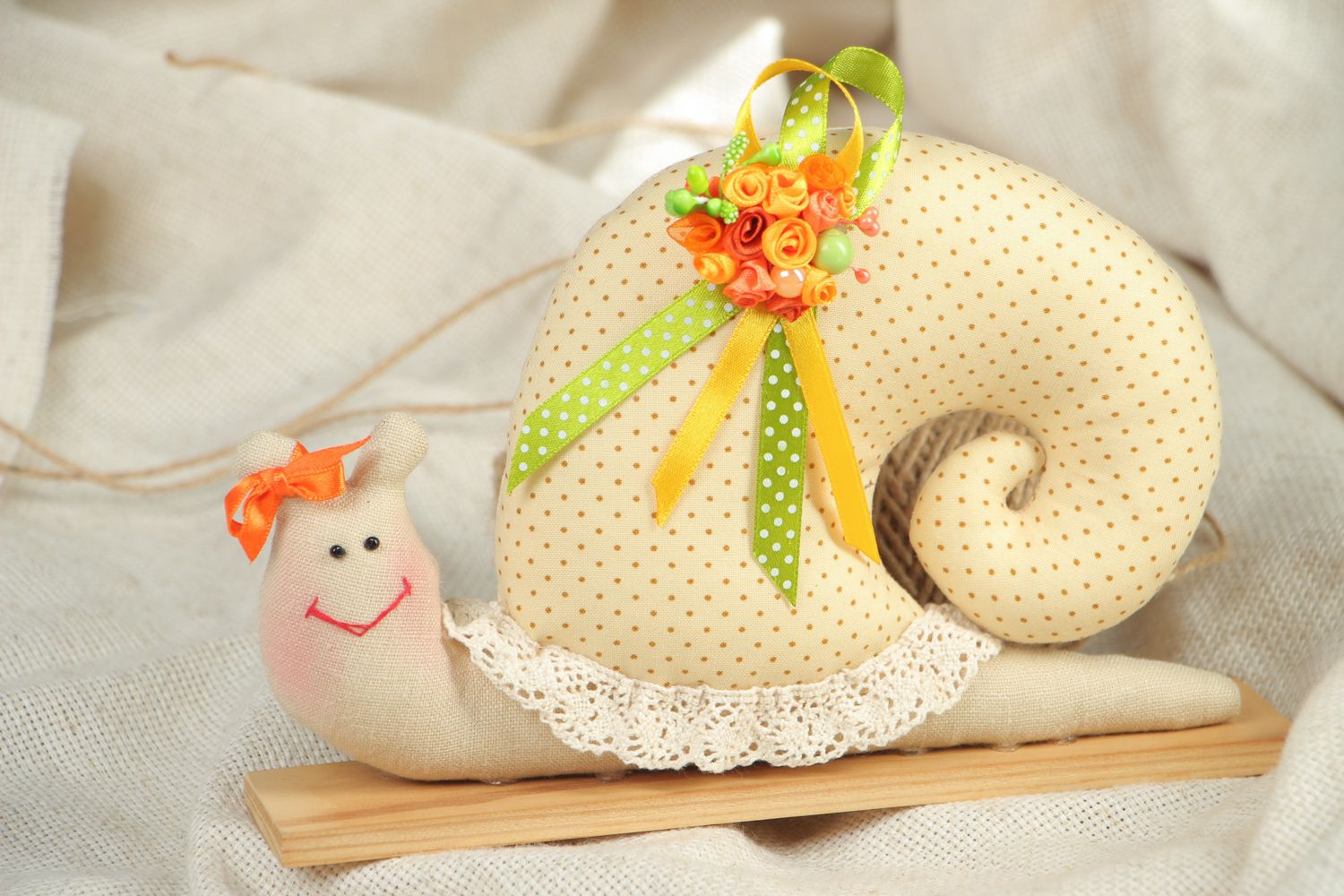 Textile toy snail on wooden holder photo 5