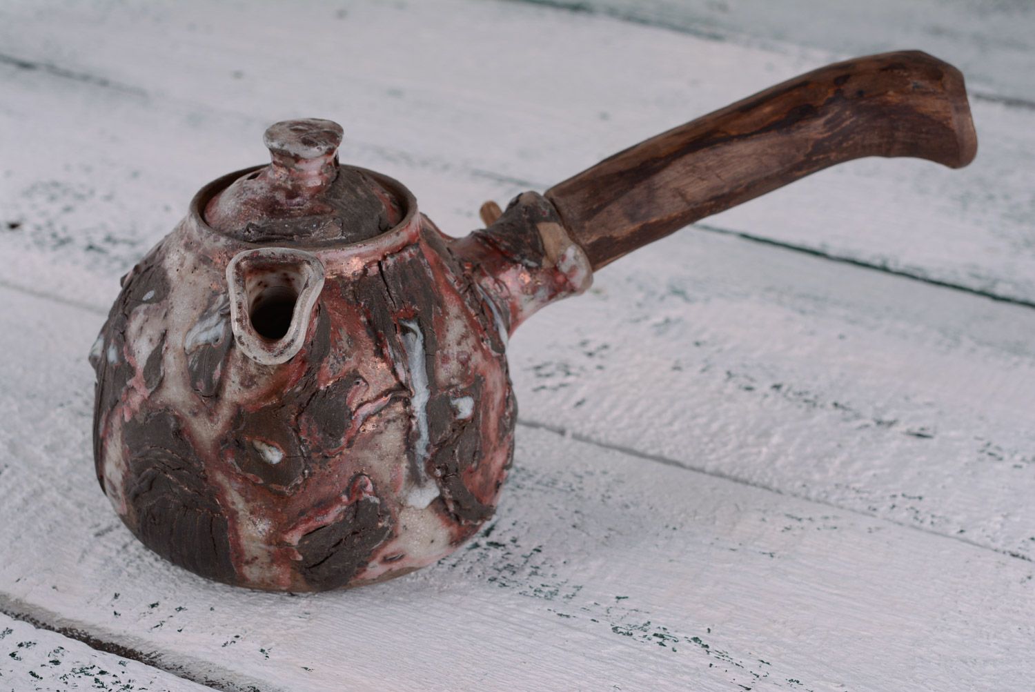 Handmade ethnic ceramic teapot fired with limited aeration with wooden handle photo 1