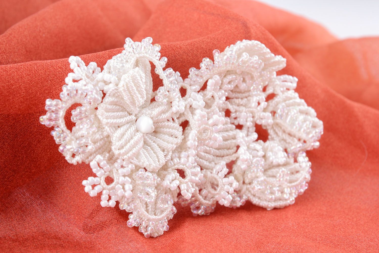 White brooch made of threads and beads photo 4