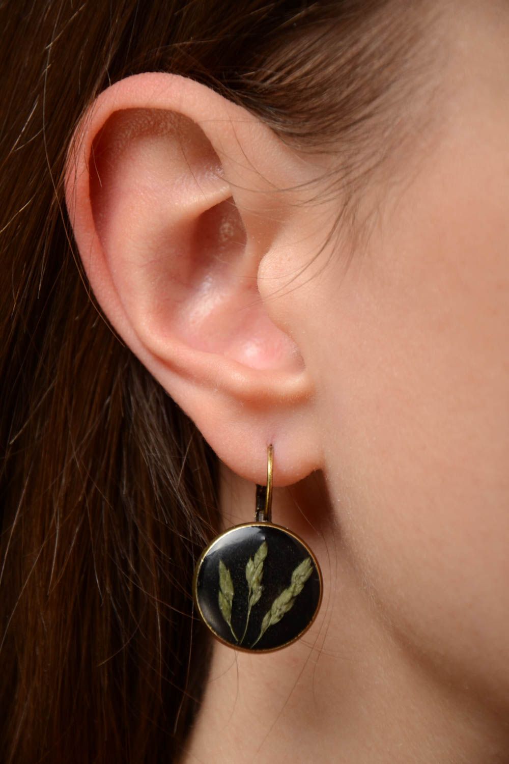 Small handmade dark round dangling earrings with natural plants in epoxy resin photo 2