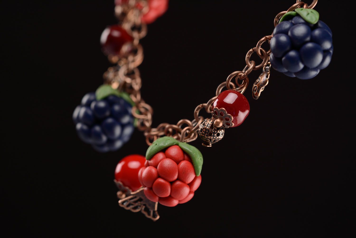 Plastic bracelet with charms in the shape of berries photo 3