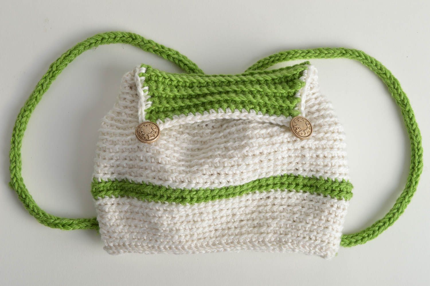 Children's handmade designer stylish crochet backpack of white and green colors photo 2