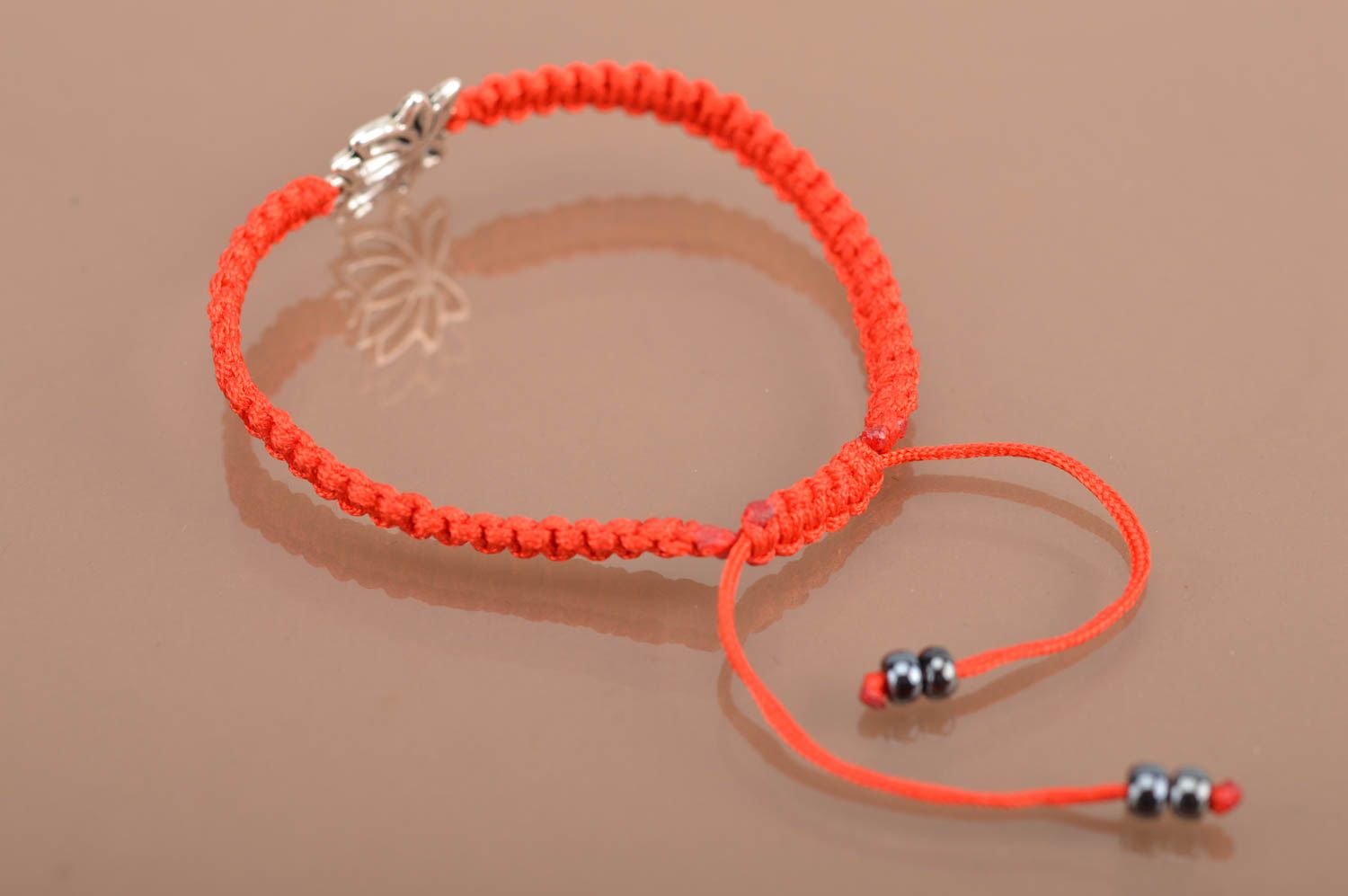 Beautiful handmade red woven silk thread bracelet with metal insert Lotus photo 5