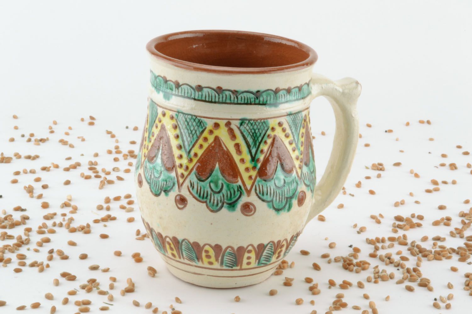 Decorative 8 oz clay cup in ethnic pattern with handle photo 1