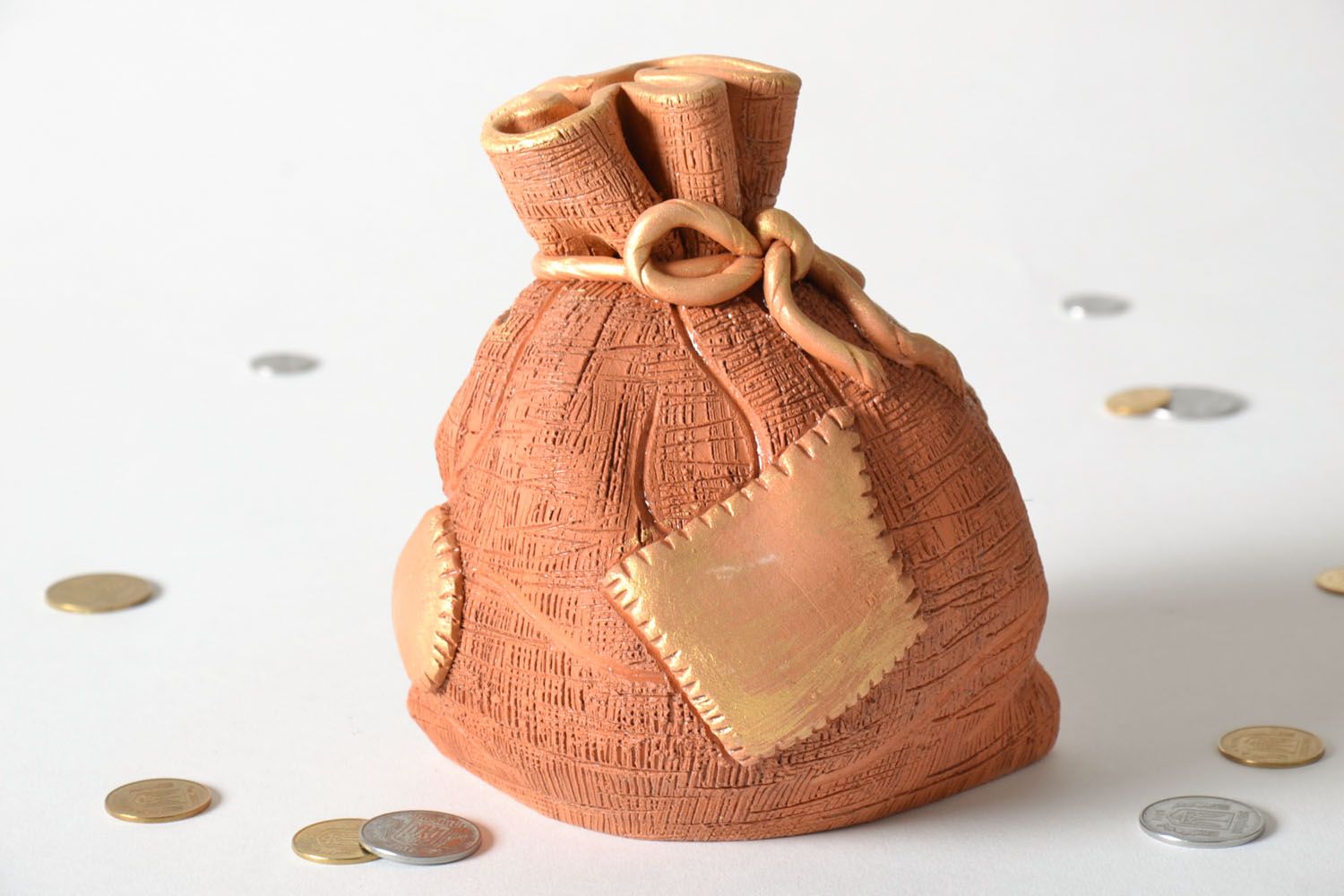 Clay money box in the shape of sack photo 1