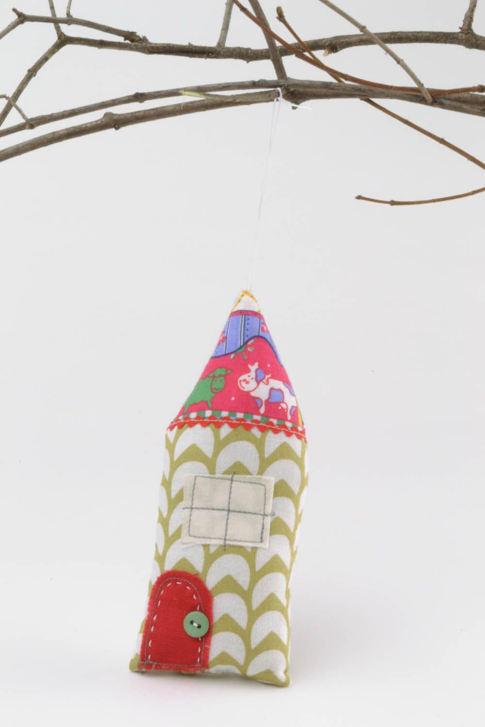 Textile pendant in the shape of a house photo 1