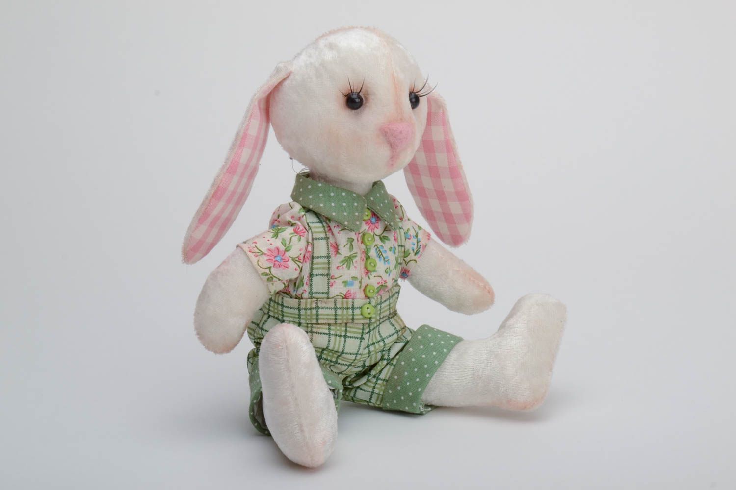 Handmade plush toy rabbit with movable paws in green trousers and floral shirt photo 2