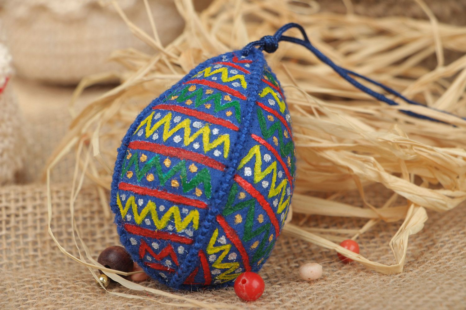 Handmade interior wall hanging Easter egg sewn of blue felt with ornaments photo 1