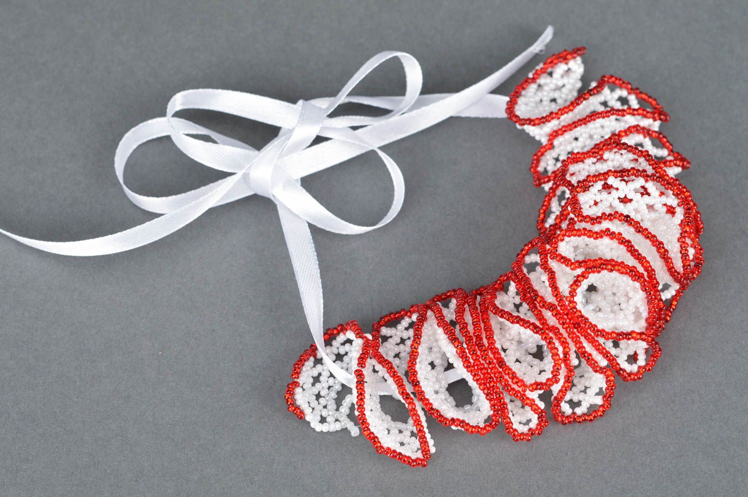 Beautiful handmade designer beaded lace bracelet with red edging photo 2
