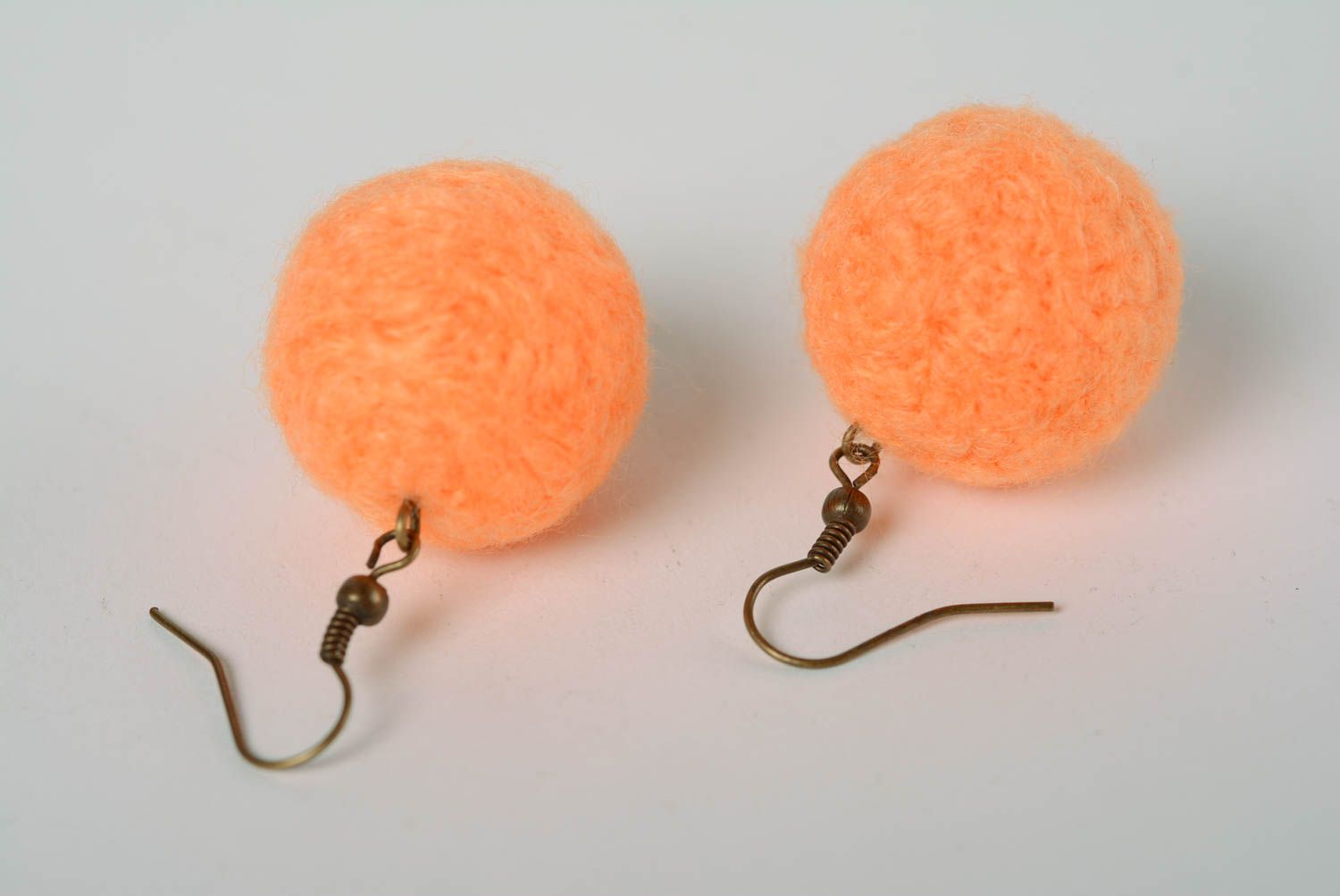 Handmade ball shaped dangling earrings felted of natural wool in peach color photo 4