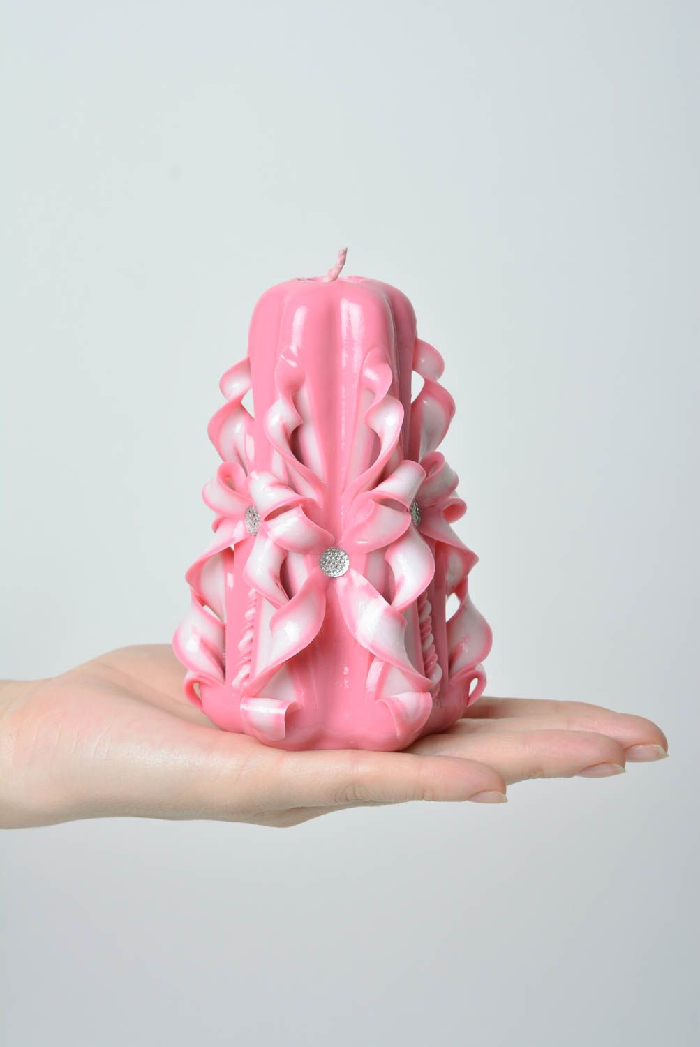 Beautiful pink handmade carved paraffin candle with decorative elements photo 3