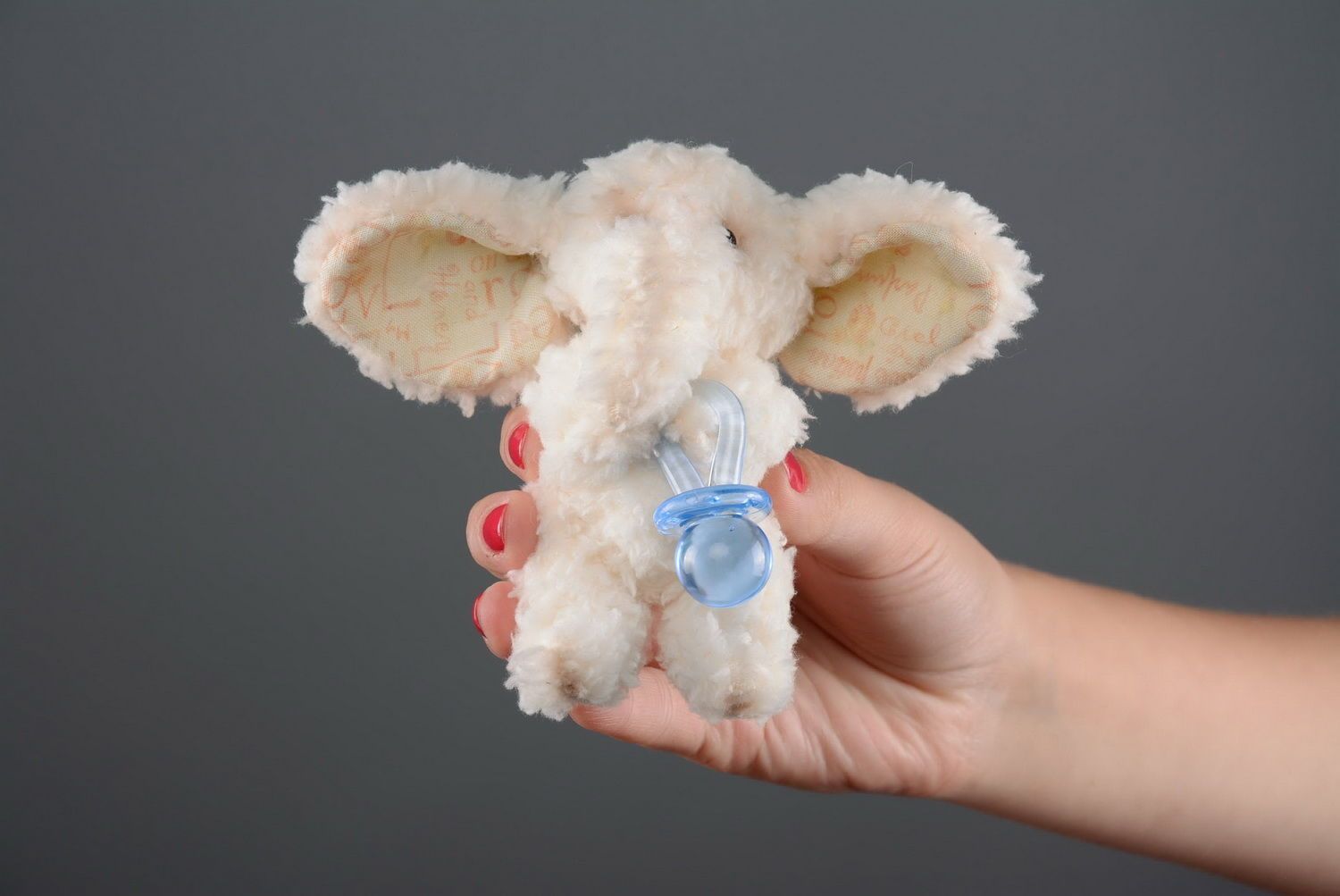 Soft toy, made of frazzle Elephant with pacifier photo 2
