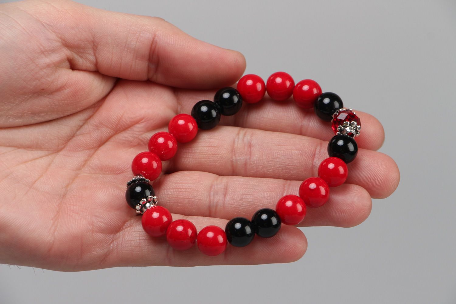 Handmade red and black stretch wrist bracelet with coral and agate stone beads  photo 2