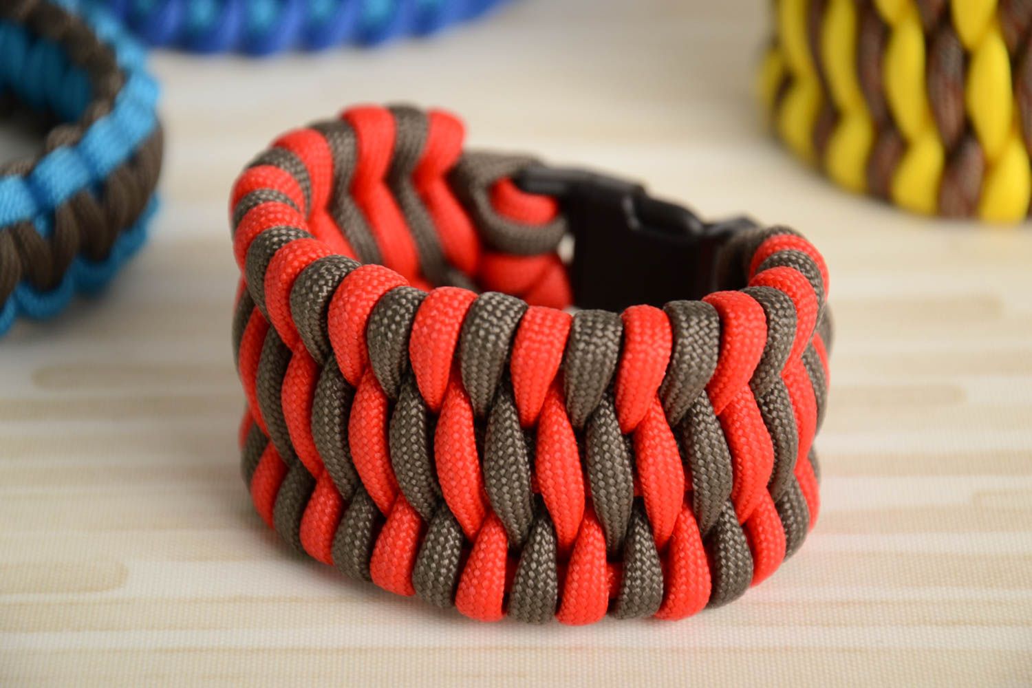 Red and gray handmade unusual woven paracord bracelet with fastener photo 1