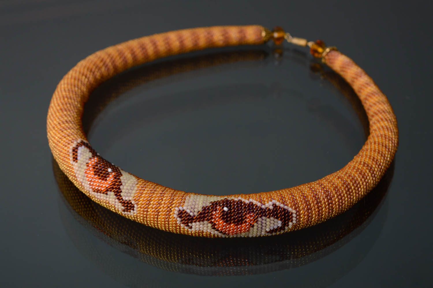 Beaded cord necklace with animal motives photo 1