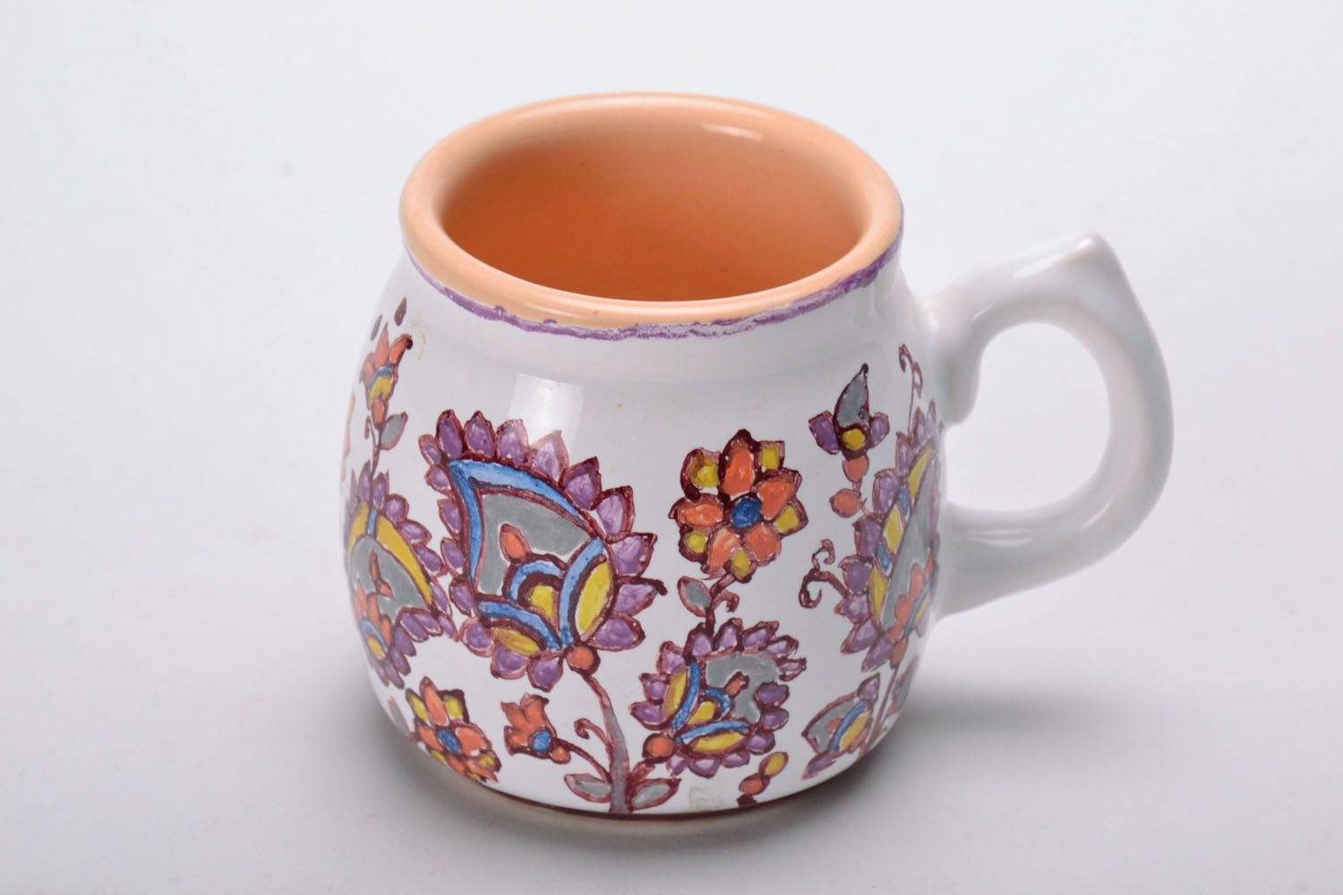 Ceramic coffee cup glazed in white and cherry color with flower pattern and handle photo 2
