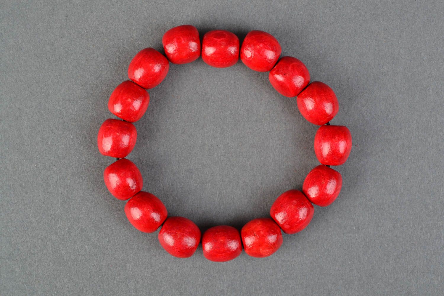 Red wooden bracelet with elastic band photo 4