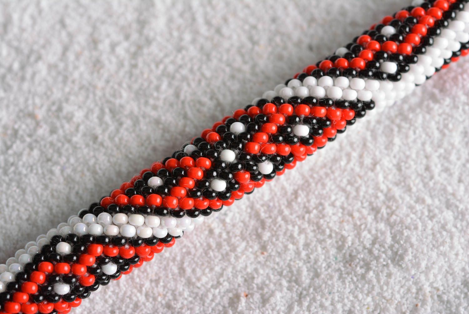 Handmade beaded adjustable cord bracelet with floral ornament in white and red colors photo 3