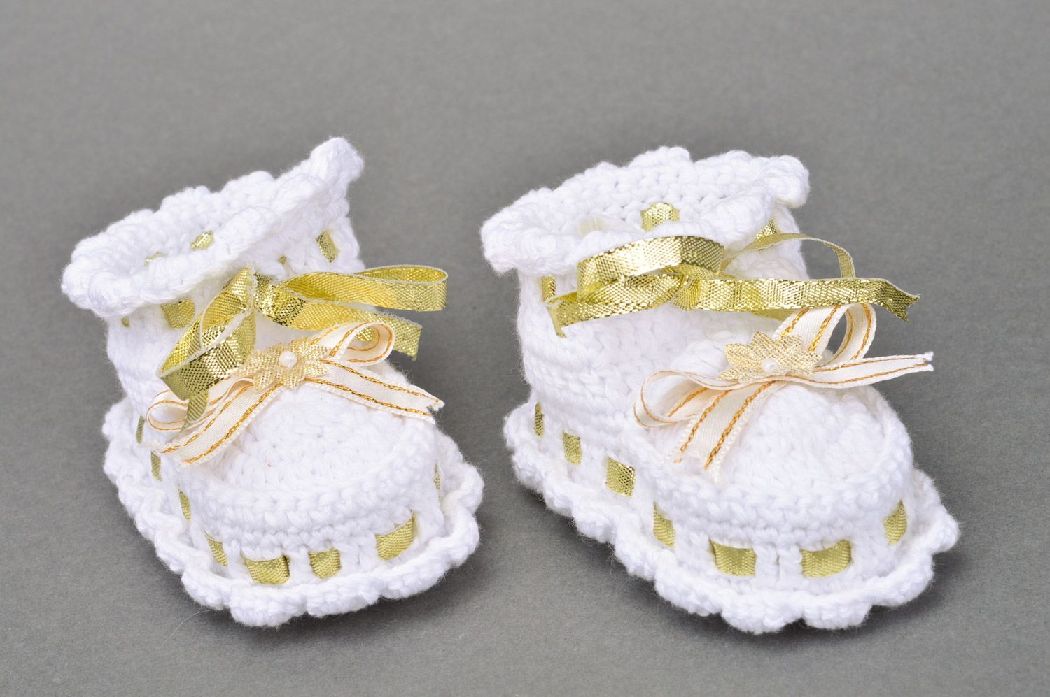 Handmade small summer white baby booties for a girl with golden ribbons photo 2