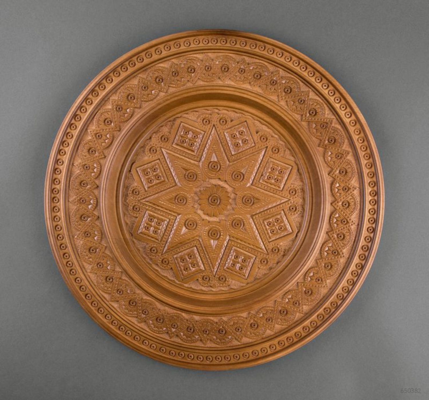 Carved decorative plate made ​​of wood photo 3