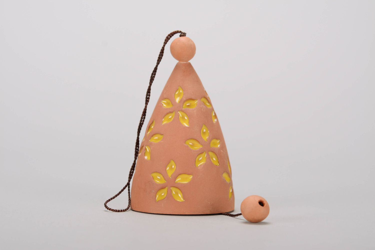 Bell made of red clay with stamping photo 1