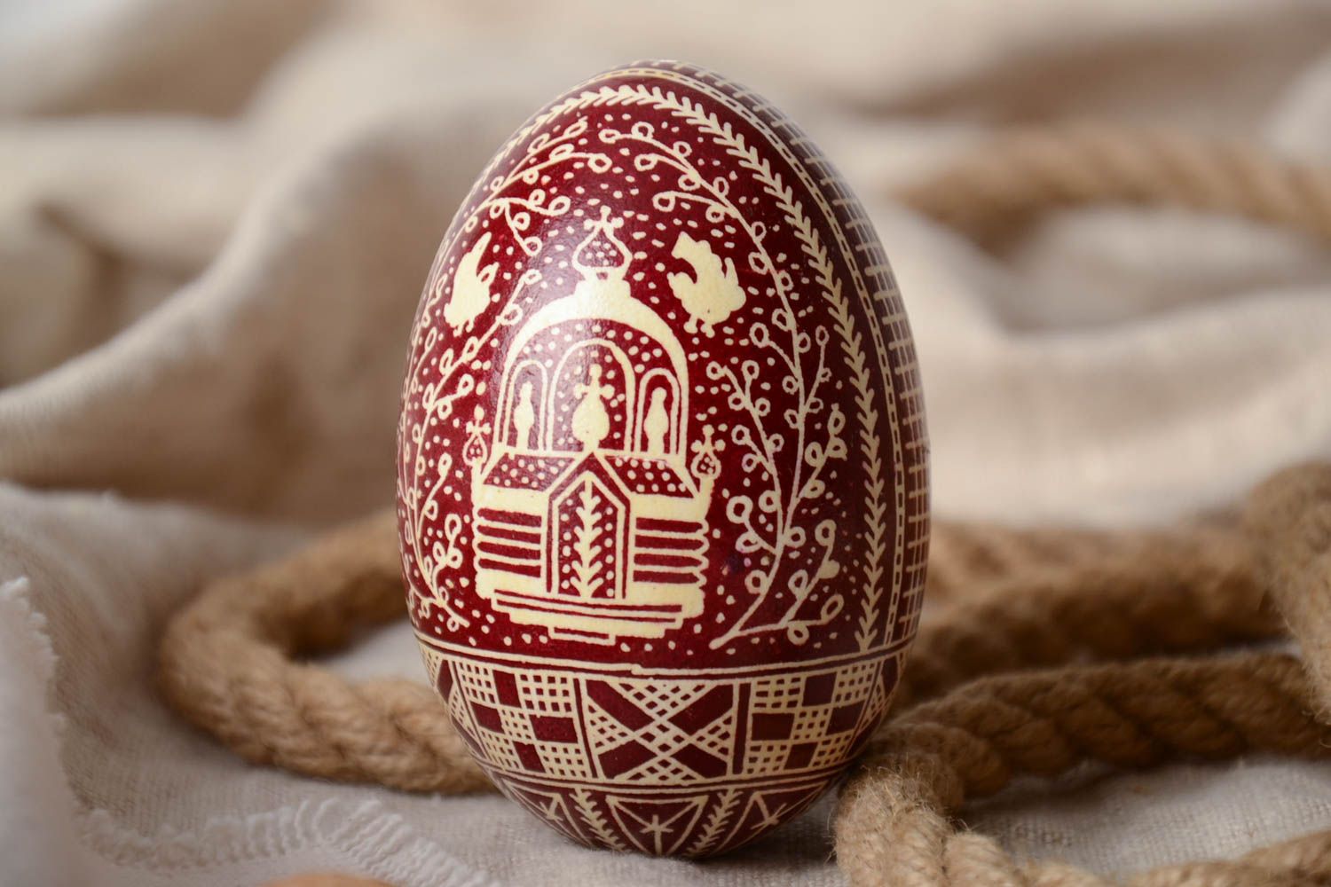 Red and white handmade painted goose egg decorated using waxing technique photo 1